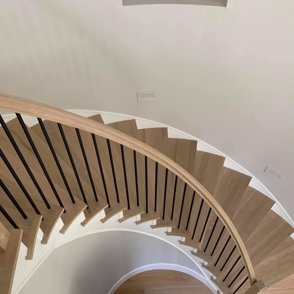 Wooden spiral staircase in a modern interior setting
